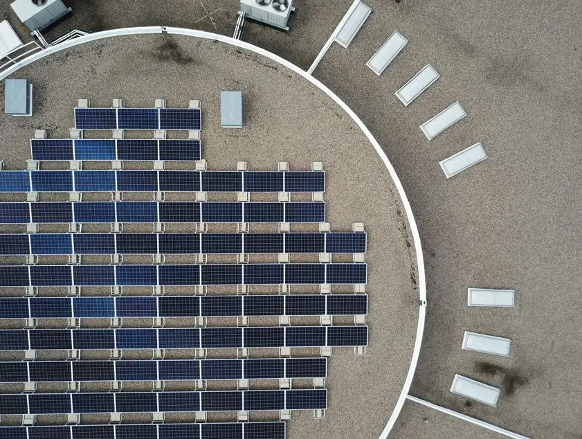 Close-up of solar panel wiring and inverter maintenance